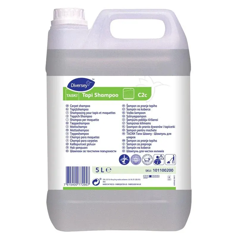 Ein 5-Liter-Kanister TASKI Tapi Shampoo von Diversey Deutschland GmbH & Co. OHG: neutrales Teppichshampoo mit Wollsiegel-Zertifizierung und O.N.T.-Technologie für dauerhafte Frische, mit weißem Etikett, Griff und Schraubverschluss.
