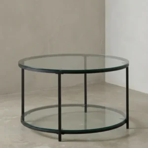 Runder Couchtisch mit zwei transparenten Glasplatten und einem filigranen, schwarzen Metallgestell, freigestellt vor weißem Hintergrund._#sku_BARWL6.610#
